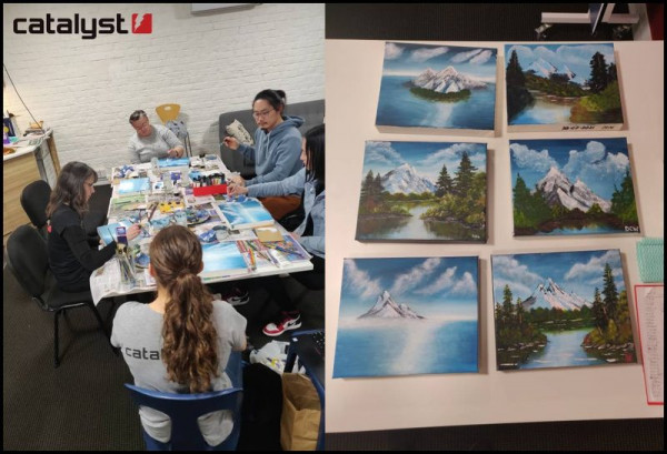 A group of people are sitting around a table painting. Also a close up of their finishing paintings snowy landscape scenes.