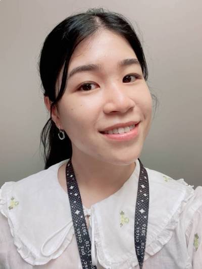 A headshot of Doris Tam who is looking at the camera and smiling